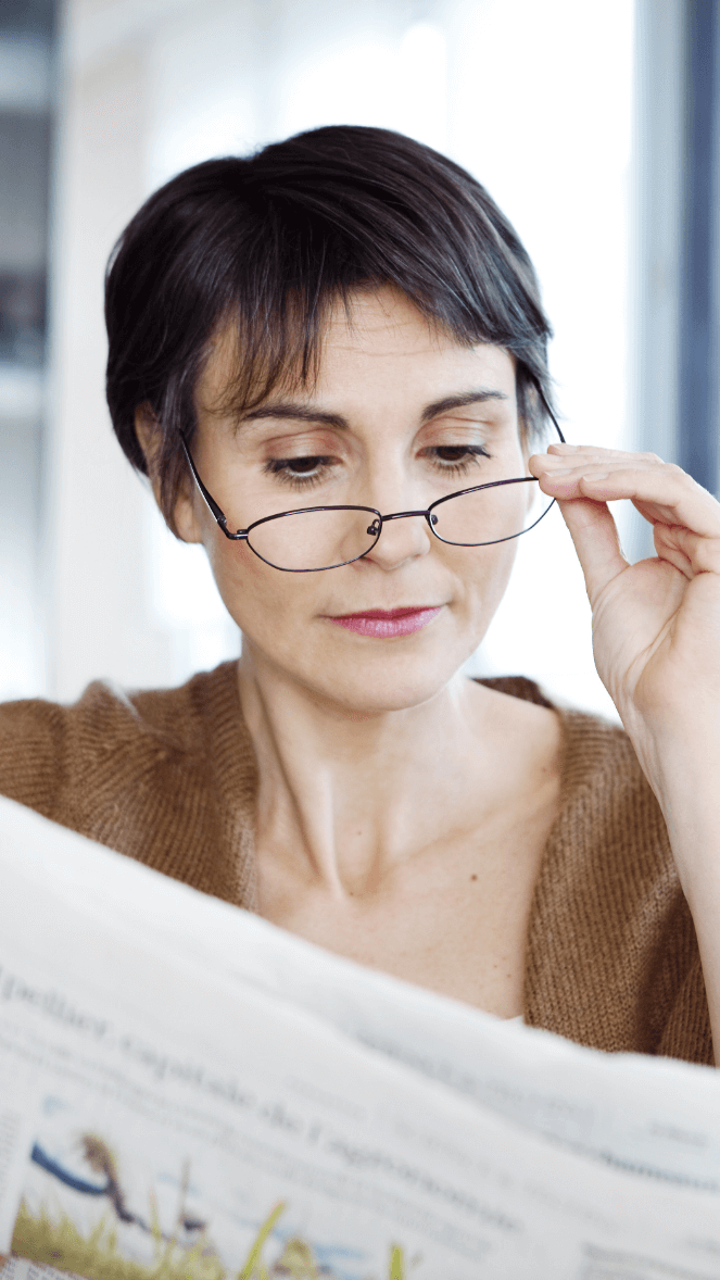 Woman reading with reading glasses