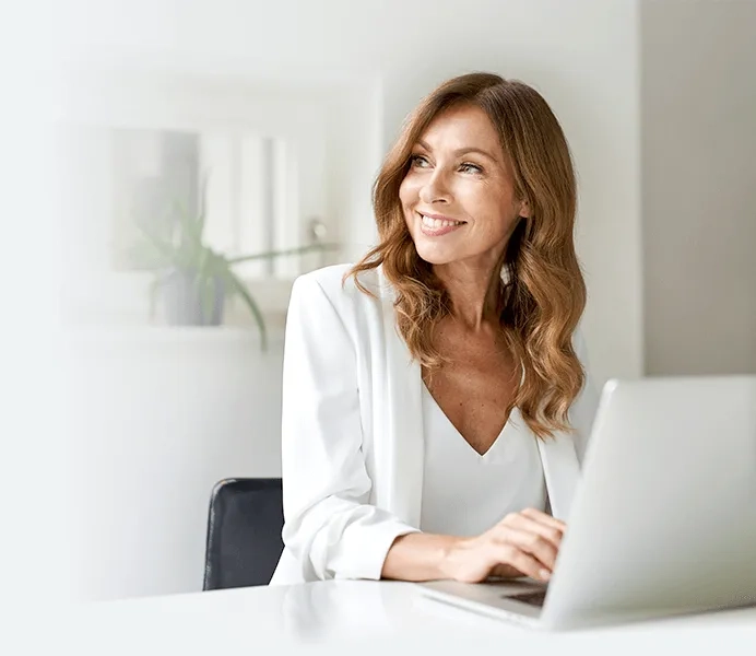 Woman on a computer smiling