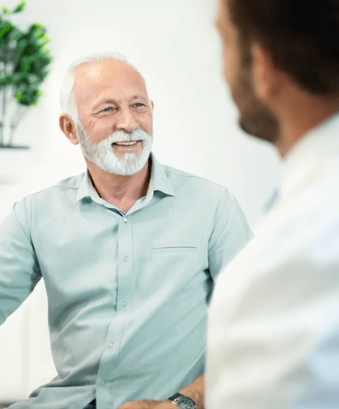 Patient talking to his surgeon